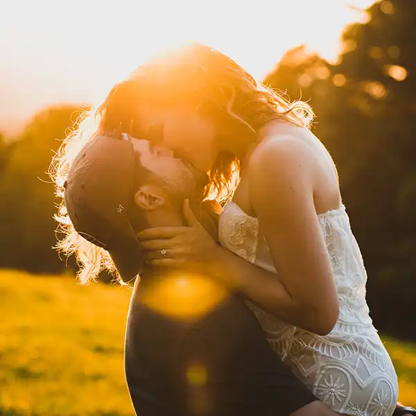 Sunset Engagement Photos with couple kissing